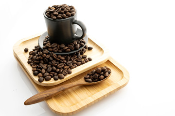 Coffee beans in a coffee mug on a white background