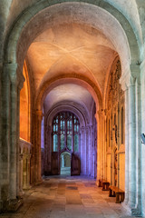 Cathedral Nave lit by coloured stained glass light