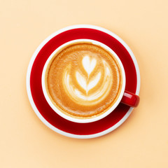 Cappuccino in red cup top view