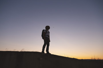 backpacker traveler walking at sunrise