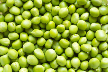 Fresh green peas top view background