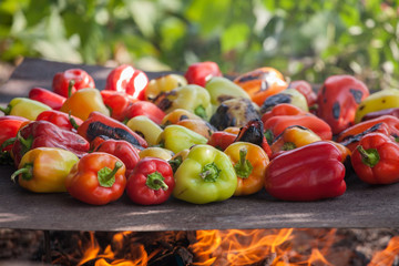 green and yellow peppers grilling on a BBQ