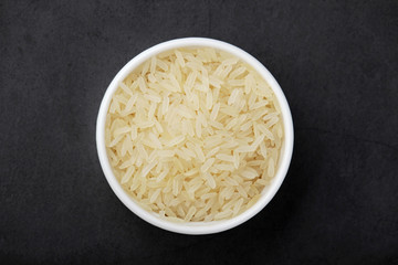 A glass bowl with white long-grain rice