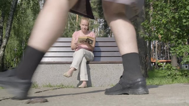 Male pervert in park. man exhibitionist opens coat in front of girl. woman gets scared and runs away.