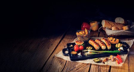 Delicious  grilled sausage with various grilled vegetables