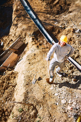 Construction worker on a heavy site doing hard work.