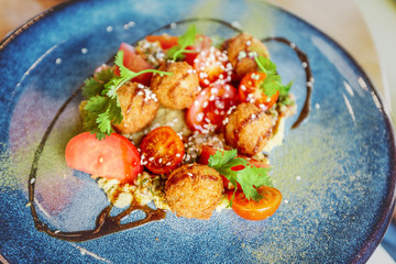 Fresh falafel with tomato on plate. Traditional middle Eastern vegetarian dish