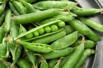 Tasty fresh peas on plate, closeup