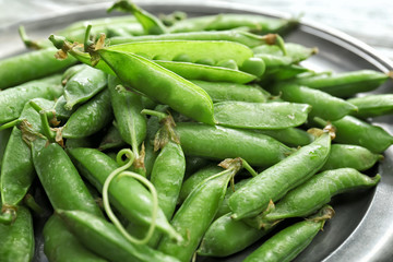 Tasty fresh peas on plate, closeup