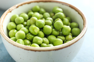 Bowl with tasty fresh peas, closeup