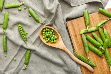 Tasty fresh peas on grey napkin