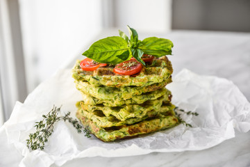 Stack of tasty squash waffles on table