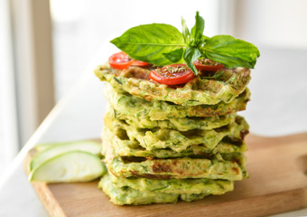 Stack of tasty squash waffles on table
