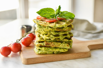 Stack of tasty squash waffles on table