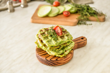 Stack of tasty squash waffles on table