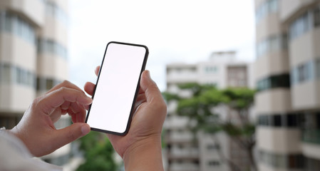Man using mobile smartphone outdoor