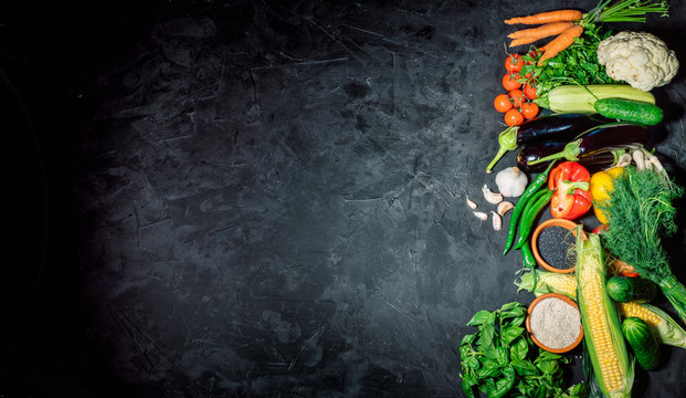 Healthy food background. Concept of healthy food, fresh vegetables on a dark background. Top view whith copy space © Andrii