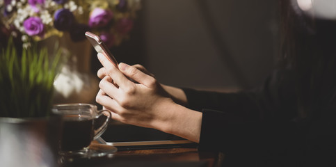 Businesswoman using smartphone in office.