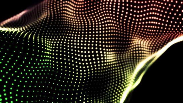 Loopable gradient waving dotted texture with shining blurred particles. Animation. Green, red, and yellow small circles flowing on black background, abstract fabric.