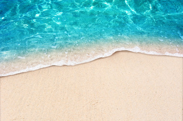 Naklejka na ściany i meble Soft blue ocean wave on clean sandy beach