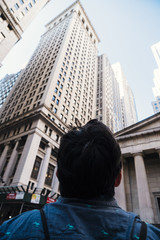 Man looking at high skyscrapers