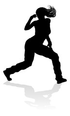 A woman street dance hip hop dancer in silhouette