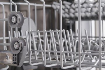 two wheels on the left to extend the container in the dishwasher