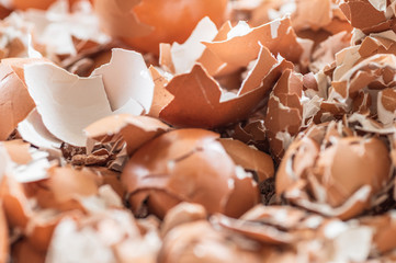 A close up of pile of empty cracked eggshells use for background texture.