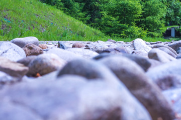 stone rock on a green hill