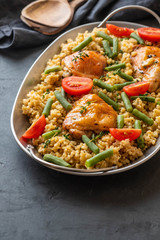 Grilled chicken thighs with bulgur, asparagus beans and tomatoes. Delicious lunch.