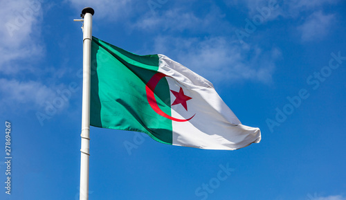 Algerian flag waving against clear blue sky