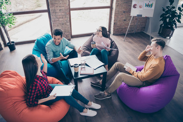 Above high angle view of smart clever cheerful glad interns preparing analysis development career...