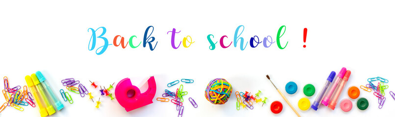 Panorama of colorful school supplies  isolated on white background with text. Back to school web banner.