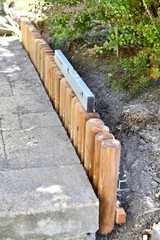 Exchanging the finished new curb next to the pavement  instead of the old curb in our garden