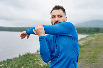 Fototapeta premium Man exercising outdoor on gloomy day