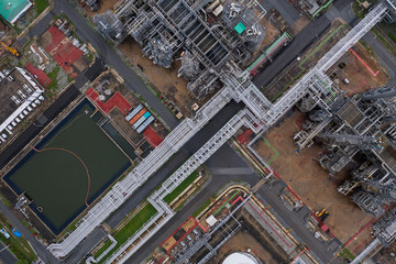 Industrial top view at oil refinery plant form industry zone ,which factory - petrochemical plant, Shot from drone of Oil refinery.evening scenery.