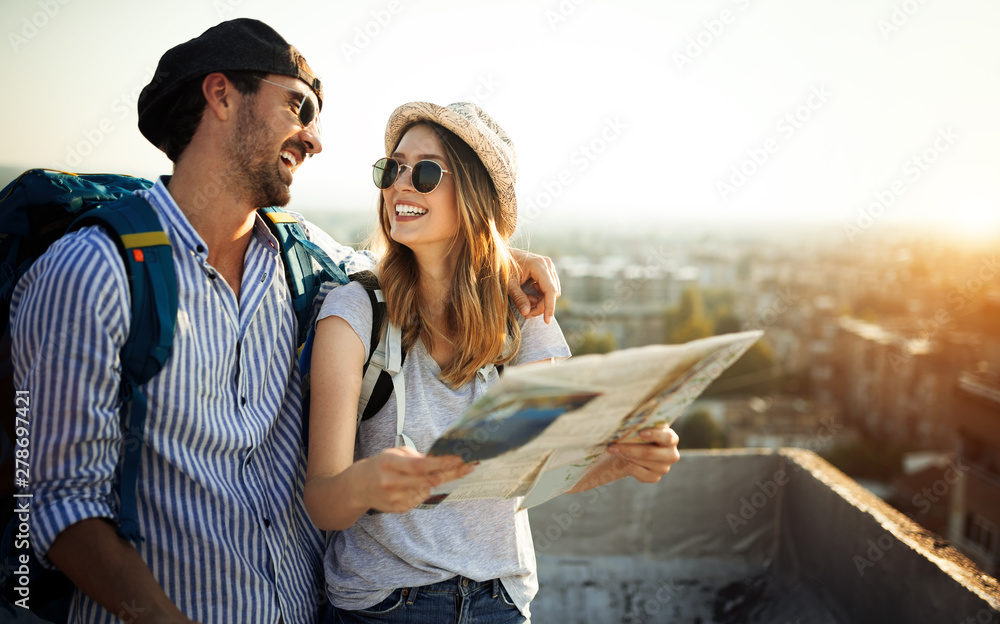 Canvas Prints Young couple travelling with a map in the city