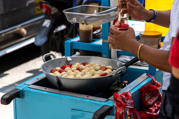 Cooking fish ball on the street