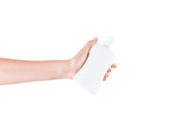 Female hand holding cream bottle of lotion isolated. Girl give cosmetic products on white background