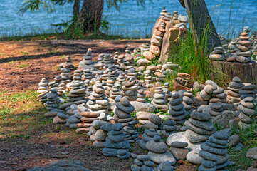 Menhirs. Pyramids of stones, stone sculpture against the water. Cairn stones piled in hills. © Konstantin