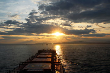 View of the sunset from the ship underway and in the port. Colorful views of the surface of the...