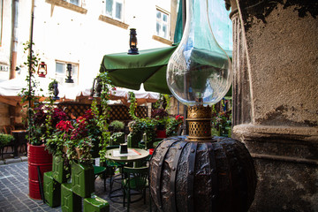gas lamp hanging in cafe in Lviv