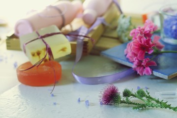 Natural soap, sea salt, body care and relaxation products on wooden background, spa procedures, healthy lifestyle