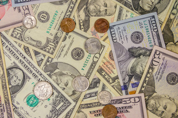 Background of different american dollars bills and coins