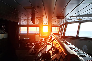 View of the sunset from the ship"s construction and navigational bridge. © masterskuz55