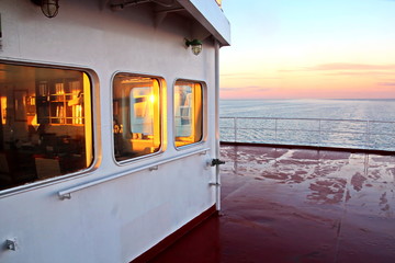 View of the sunset from the ship"s construction and navigational bridge. © masterskuz55