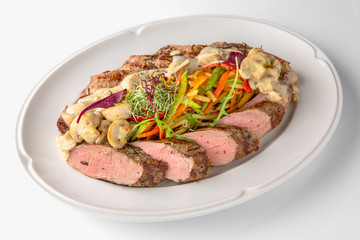 Slicing gourmet meat, pastrami, podcherevka, bastrum, beef and pork. Banquet festive dishes. Gourmet restaurant menu. White background.