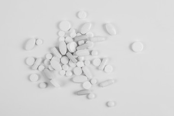 High number of pills on white background surface. High resolution image for pharmaceutical industry.