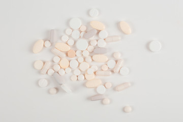 High number of pills on white background surface. High resolution image for pharmaceutical industry.