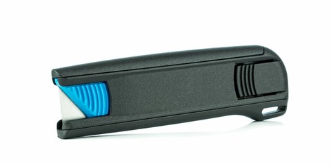 A retractable pocket sized box cutter knife in the closed position on a white background